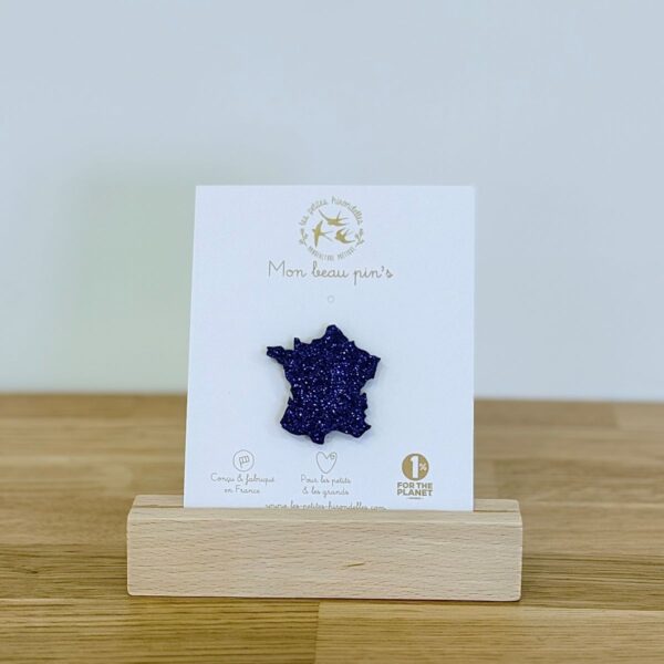 Pin's feutrine pailletée bleu en forme de carte de la France