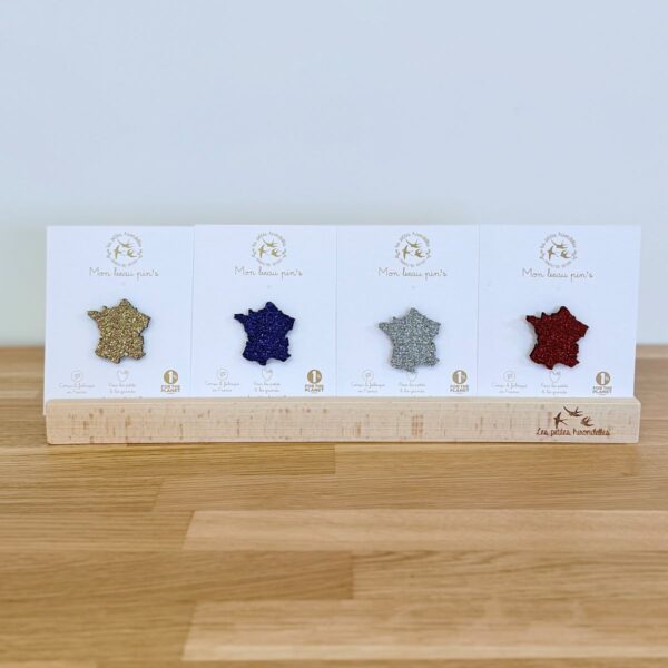 Pin's feutrine pailletée en forme de carte de la France