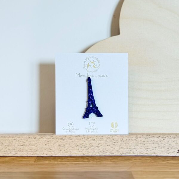 Pin's feutrine pailletée bleu en forme de tour Eiffel